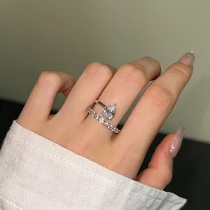 S925 sterling silver wrap ring with a pear-cut zircon and pave settings on model