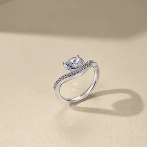 Macro shot of S925 sterling silver crown ring with oval zircon and wavy diamond band