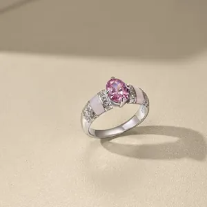 Macro view of S925 sterling silver ring showing pink oval gemstone and engraved hallmark