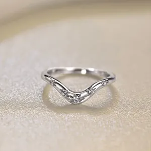 Macro shot of V-shaped S925 silver ring with five oval zircons and star-shaped prongs