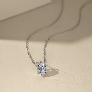 Macro view of oval-cut zircon pendant with 925 sterling silver chain on soft background