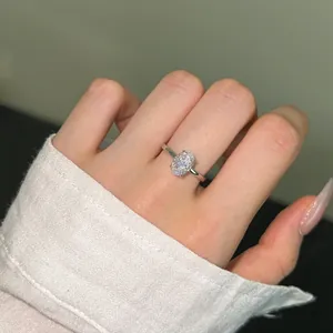 On-hand display of S925 sterling silver ring featuring an oval ice-cut cubic zirconia