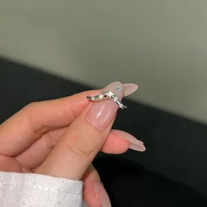 Macro shot of V-shaped S925 sterling silver ring with sparkling pave cubic zirconia