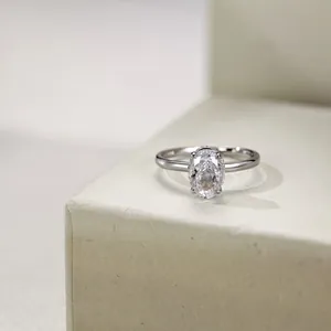Macro shot of an oval-cut ice flower cubic zirconia ring on a minimalist pedestal