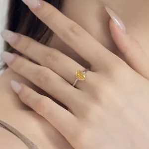 Close-up of elegant S925 silver ring featuring a yellow oval-cut ice flower zircon stone