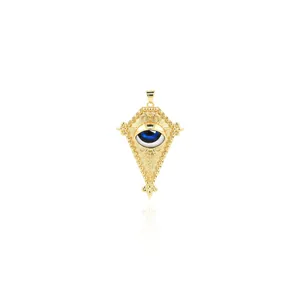 Macro view of 18K gold plated Evil Eye pendant with blue inlay and granulation detail