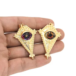 Detail of 18K gold-plated rhombus pendants featuring colorful mystic eye resin inserts