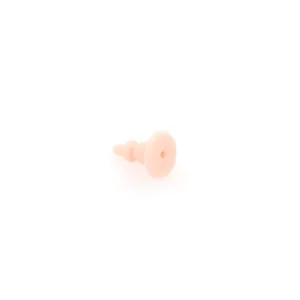 Macro detail of a flesh-pink silicone earring back with a three-tier cone design