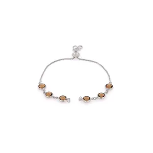 Elegant silver adjustable bracelet featuring six round brown gemstones in bezel settings