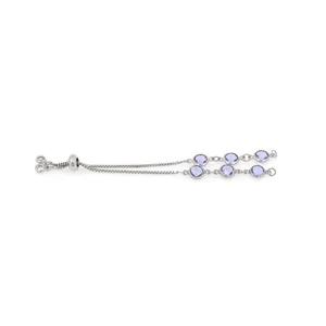 Detail of adjustable silver bracelet featuring round purple crystals and slider clasp