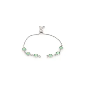 Detail of adjustable silver bracelet with six translucent light green gemstones