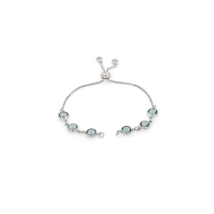 Close-up of adjustable silver bracelet featuring six faceted light blue gemstones