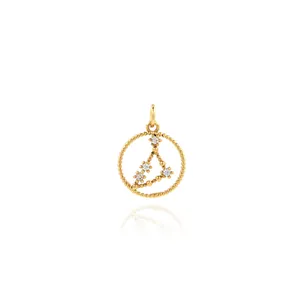 Macro shot of 18K gold plated zodiac pendant with micro-set cubic zirconia crystals