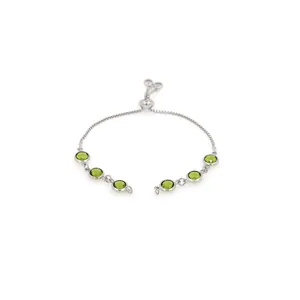 Detail view of adjustable silver bracelet with six brilliant round green zircons