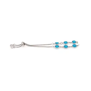 Detail of silver bolo bracelet with double-row blue gemstones and adjustable clasp