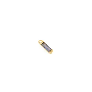 Macro detail of rectangle purple gemstone pendant in 18K gold plated frame