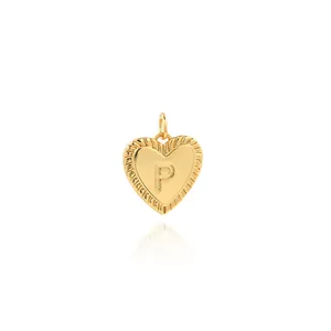 Macro shot of 18K gold-plated heart pendant with letter P and micro-pave cubic zirconia