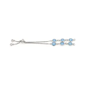 Detail of adjustable silver tone bracelet with sky blue round gemstones and bolo slider clasp