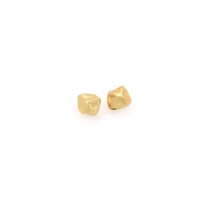 Macro detail of irregular 18K gold-plated beads with matte textured finish for DIY jewelry