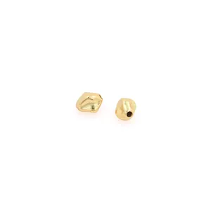 Macro shot of 18K gold-plated irregular matte spacer beads for DIY jewelry making