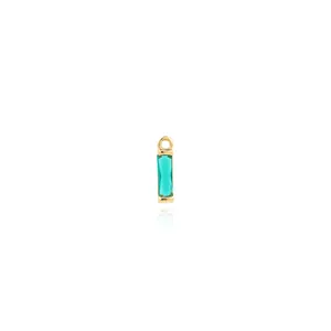 Macro shot of 18K gold plated rectangular green gemstone pendant with mirror reflection