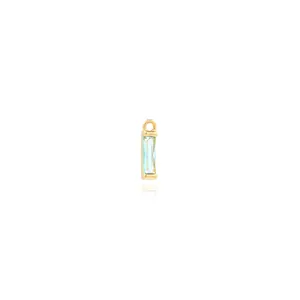 Macro detail of 18K gold-plated rectangular light blue zircon pendant with top loop