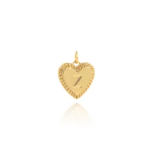 Macro shot of 18K gold plated heart pendant with letter Z and ribbed texture details