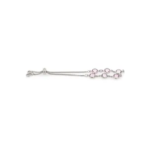 Detail of adjustable silver chain bracelet featuring round pink gemstones and slider clasp