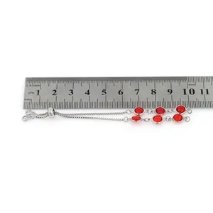 Detail view of 18K gold plated silver chain bracelet with red gems showing 4.5cm length measurement