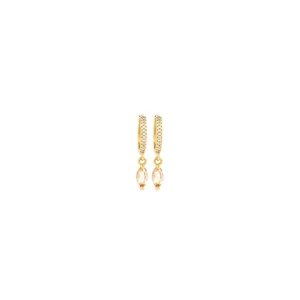Macro detail of 18K gold earrings featuring marquise champagne stones and pavé zirconias