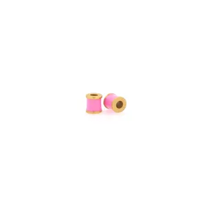 Detail of pink enamel cylinder beads with 18K gold plating for DIY jewelry making