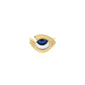 Detailed macro view of 18K gold-plated Evil Eye pendant with blue enamel and dual loops