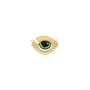 Detailed close-up of 18K gold-plated Evil Eye pendant with green enamel and sunburst texture