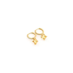 Close-up of 18K gold plated hoop earrings with square yellow gemstones and zircons