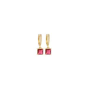 Macro detail of 18K gold plated earrings with zircon paving and square pink gemstones