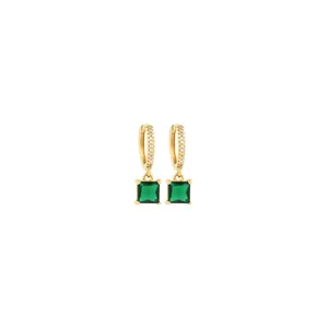Detail of 18K gold plated earrings with emerald green square stone and micro zircon inlay