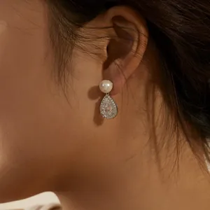 Elegant S925 silver earrings featuring a round white pearl and pear-cut cubic zirconia