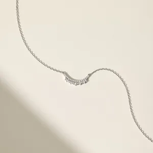 Macro detail of silver smile necklace showing exquisite pavé cubic zirconia setting