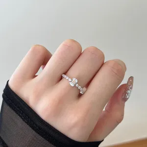 Elegant S925 sterling silver ring featuring an emerald-cut zircon on a beaded band
