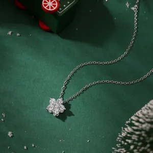Detail of S925 sterling silver flower pendant with zircons against a winter backdrop