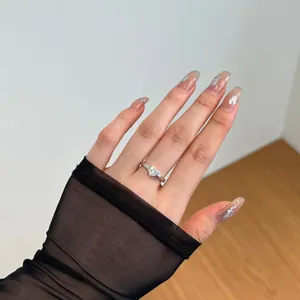 Close-up of S925 silver ring featuring a heart-shaped zircon on a model's finger