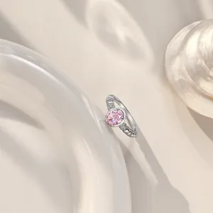 Elegant S925 silver ring featuring a large oval pink zircon and beaded band on a shell