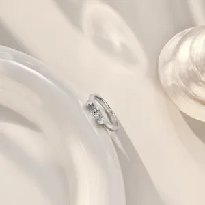 Elegant S925 sterling silver ring with marquise-cut zircon on white ceramic vessel