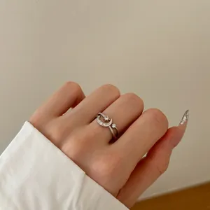 Macro detail of S925 silver ring featuring crescent moon and star with zircon stones