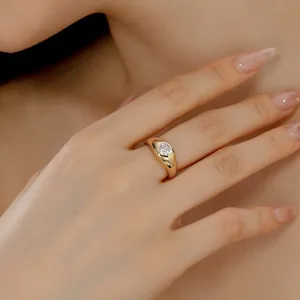 Elegant 925 sterling silver gold plated ring with heart shaped zircon on finger