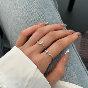 Detail of S925 sterling silver moon and star rings with cubic zirconia inlay for women