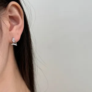 Elegant S925 sterling silver leaf stud earrings with marquise zircon on a female model