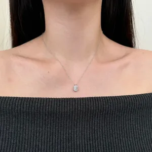 Close-up of a rectangular ice-cut zircon pendant in a bezel setting on a silver chain