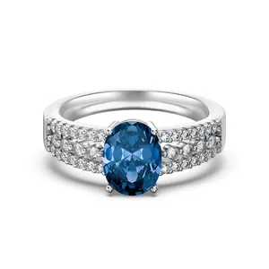 Luxurious S925 silver ring featuring an oval blue zircon and three rows of clear side stones