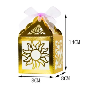 Detailed view of golden laser-cut house-shaped favor box with dimensions 14x8x8cm